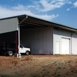 Steel agricultural shop with garage doors