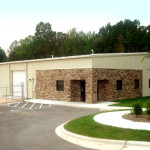 Steel office and storage building with brick entrance