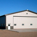 Large steel equipment storage and workshop with 30’ Door