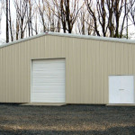 Tan steel home storage building with double door and garage door