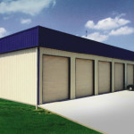 Steel storage building with garage doors and blue roof