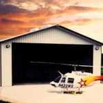 Steel hangar with helicopter and garage door