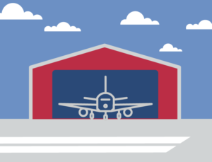 Icon of an airplane in a metal aircraft hangar.