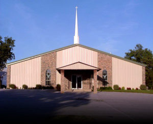 Photo of a RHINO metal church building in Texas with attractive stone trim.