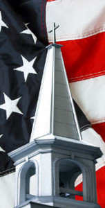 A church steeple and an American flag denotes steel church building in the U.S.