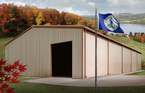 The Virginia state flag flies before a metal building near a colorful fall forest in Virginia