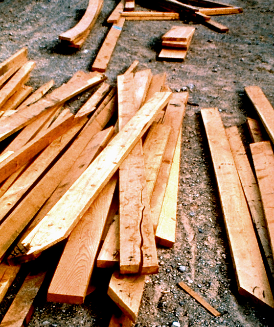 photo of a pile of split, warped, and discarded lumber