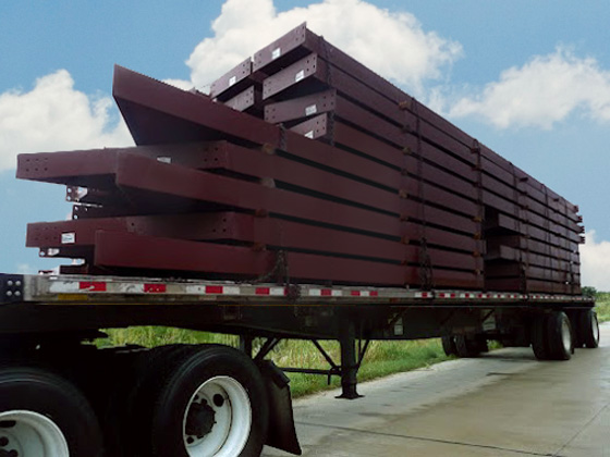 The steel framing for a RHINO metal building loaded on a truck, ready for shipping
