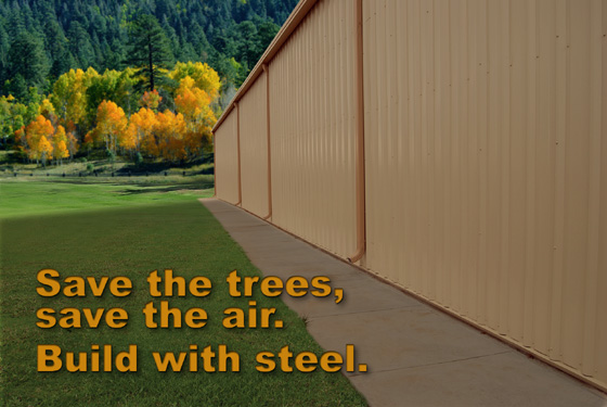 The side of a metal building in an area before a forest with the heading: Save the Trees, Save the Air. Build with Steel.