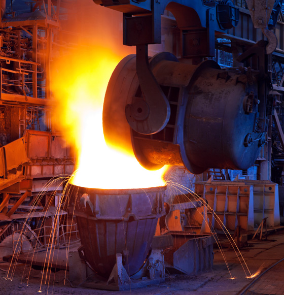 Hot molten steel being poured in a steel mill