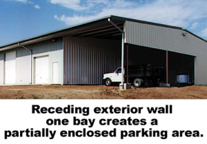 An agricultural metal building extends to create a open-air vehicle cover