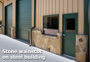 Tan and green metal building with native stone wainscot trim