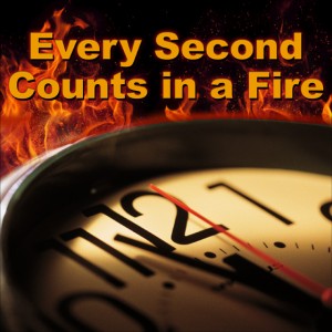 Ticking Clock before a background of fire, with the caption "Every Second Counts in a Fire"