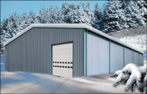Image of a snow-covered metal building in winter.