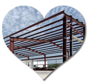 Heart-shaped photo of a metal building under construction