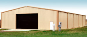 Photo of a large beige RHINO metal barn with tan trim.