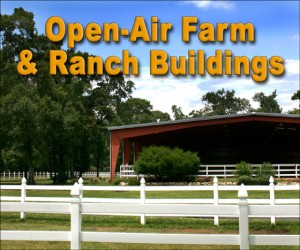 Large open-sided steel building horse riding arena surrounded by white fencing