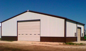 Photo of a large RHINO steel building with dark brown trim.
