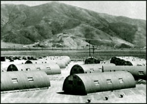 Older photograph of military base Quonset hut quarters
