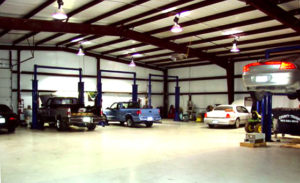 Photo of the open interior of a RHINO car repair building.