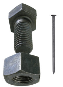 Photo of a hefty steel framing bolt and nut compared to a simple nail.