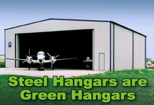 Gray steel aircraft hangar with dark blue trim and private plane