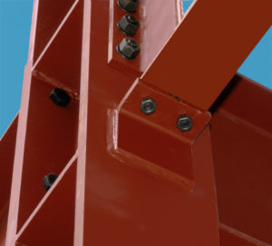 Close-up of steel framing pieces bolted together.