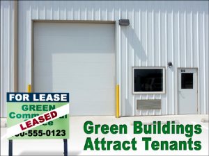 Close-up of an industrial green metal building with a "For Lease" sign in from of it.