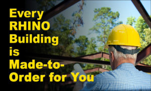 Photo of a builder directing the framing of a steel building under construction.