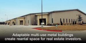 Large warehouse-type structure in an industrial park. Tan stucco with stone trim.