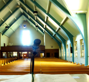 Photo of interior of a steel-framed church sanctuary.