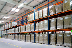 Photo of huge racks stocked with products as used in steel warehouses and distribution centers.