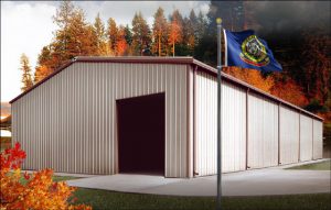 white and brown metal building in Idaho near forest with state flag flying