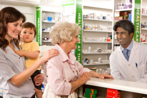 Three generations pictures at the pharmacy counter.