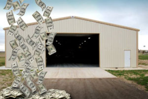 Photo of a RHINO metal building with a shower of money falling in front of it to indicate savings.