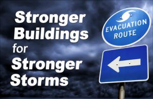 dark, stormy sky with a hurricane evacuation route sign with the text Stronger Buildings for Stronger Storms
