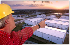 Builder shows large photo of Texas industrial building park.