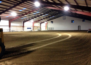 Photo of the inside of a RHINO indoor riding arena.