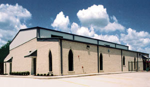 Photo of a RHINO church builoding with white brick trim.