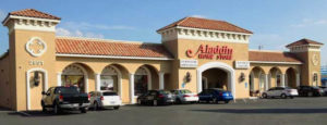 Lovely Spanish-inspired furniture store building with clay tile roof.