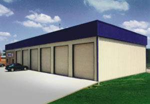 photo of a six-bay mechanics shop and office with a blue metal roof.