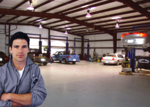 Photo of mechanic inside a RHINO building used as auto repair shop.