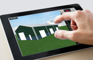 Photo of someone designing a steel building on an electronic tablet.