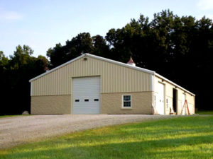 Beautiful RHINO steel barn with stone trim.